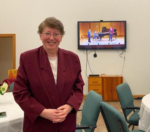 Sr. Lou Ella Hickman stands near the television in the Sisters of the Incarnate Word and Blessed Sacrament convent meeting room in Corpus Christi, Texas, prior to the May 11 performance of "Chavah's Daughters Speak" at 92Y in New York City. The musicians 