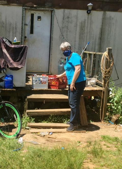 Dubuque Franciscan Sr. Mary Beth Goldsmith delivers food to a home in Mississippi. (Courtesy of Sr. Nancy Schreck) Dubuque Franciscan Sr. Mary Beth Goldsmith delivers food to a home in Mississippi. (Courtesy of Sr. Nancy Schreck)