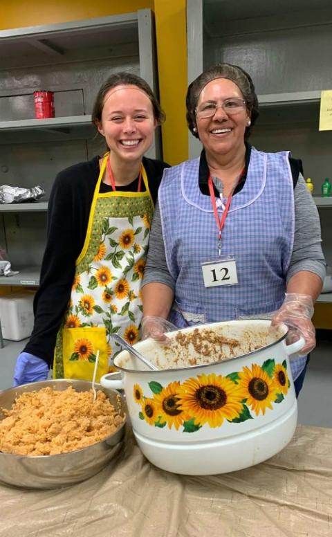 Juanita, right, and I serve a picadillo and rice at Annunciation House in some sunflower gear. (Provided photo)