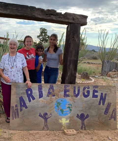 From left: Sister Chabela, Samantha Kominiarek, and Chaparral youth Oscar and Melenie in front of the Casa Maria Eugenia sign after an afternoon of playing in the yard (Provided photo) From left: Sister Chabela, Samantha Kominiarek, and Chaparral youth Oscar and Melenie in front of the Casa Maria Eugenia sign after an afternoon of playing in the yard (Provided photo)