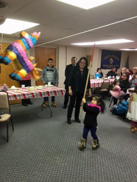 A girl hits a piñata at Centro San Pablo, a drop-in center for immigrants in Salem, Ohio run by St. Paul church.
