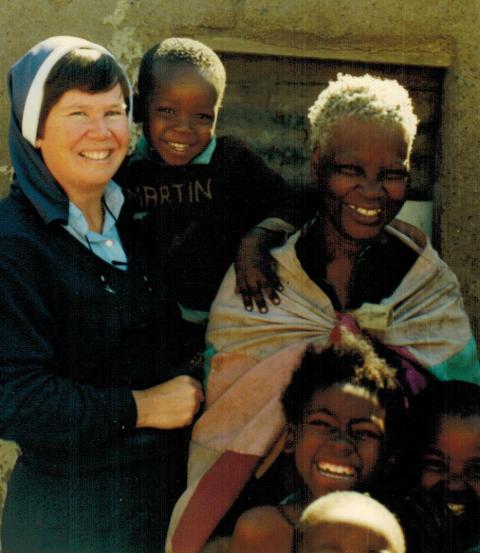 Mercy Sr. Jean Evans with a village family (Provided photo)