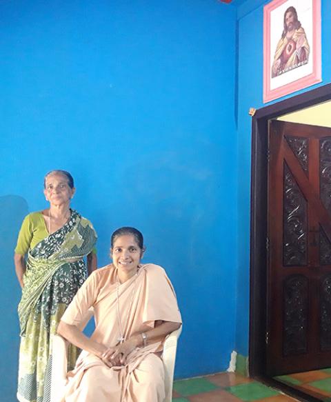 Sr. Theresa Crasta, seated, visits her mother at her home in Bela, a village in Kerala on the border of Karnataka state in southwestern India, after escaping Afghanistan. (Thomas Scaria)