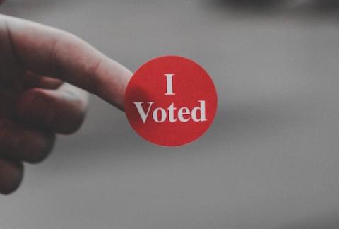 "I voted" sticker (Unsplash/Parker Johnson)