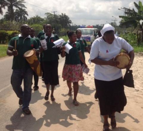 Sr. Freda Ehimuan (with drum) leads a prayer procession for World AIDS day in Kirikiri town, Lagos, Nigeria. (Courtesy of Sr. Freda Ehimuan)