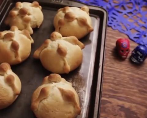 Students taught us how to make pan de muerto, adding each ingredient, kneading and shaping the "bones" that decorate the top of this sweet bread. (Screenshot by Martha A. Kirk)
