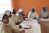 Missionary Sisters of the Holy Family talk about their experiences as part of their 2019 canonical visitation meeting in Nairobi, Kenya. (Courtesy of Lilian Atieno)