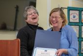 Sr. Robbie Pentecost (left), executive director of the New Opportunity School for Women in Berea, Kentucky, presents Barbara Harvey with a completion certificate from NOSW's two-week residential program in 2018. 