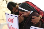A nun is consoled during a Sept. 13, 2018, protest in Cochin, India. The protest was to demand justice after a former religious superior accused Bishop Franco Mulakkal of Jalandhar of raping her. A court acquitted Mulakkal of all charges Jan. 14. (CNS)