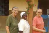 Three Marianite sisters (from left), Suellen Tennyson, Pascaline Tougma and Pauline Dourin, are pictured in an undated photo near the clinic where they serve in Yago, Burkina Faso. (CNS/Courtesy of the Marianites of the Holy Cross)