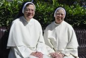 Sr. Elizabeth Anne Allen and Sr. Jean Marie Warner of the Congregation of Dominican Sisters of St. Cecilia in Nashville, Tennessee, share a joyful moment Sept. 12 as they celebrate their golden jubilee, which officially occurred July 8, and 50 years of fr
