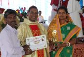 Lalita Beero and her husband receive recognition April 24 from Bishop Sarat Chandra Nayak. (Sujata Jena)
