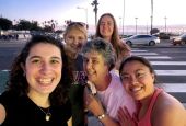 From left: Nina Dorsett, Emily Michaelis, Sr. Louise Ann Micek, Emma Shay, and I are pictured in a selfie. We ate at a restaurant in downtown San Diego after our service with migrants to reflect about our experiences. (Courtesy of Sisters of St. Joseph)