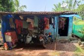 The one-room shed where a day laborer and his wife and daughter were living, when Rose Cherian Vachaparampil began the "live crib" project to build a house for the family (Courtesy of Rose Cherian Vachaparampil)