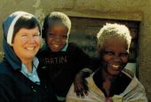 Mercy Sr. Jean Evans with a village family (Provided photo)