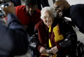 Loyola-Chicago basketball chaplain Sister Jean Dolores Schmidt, poses with fans for a photo before the first half of a regional final NCAA college basketball tournament game on March 24, 2018, in Atlanta. (AP/David Goldman)
