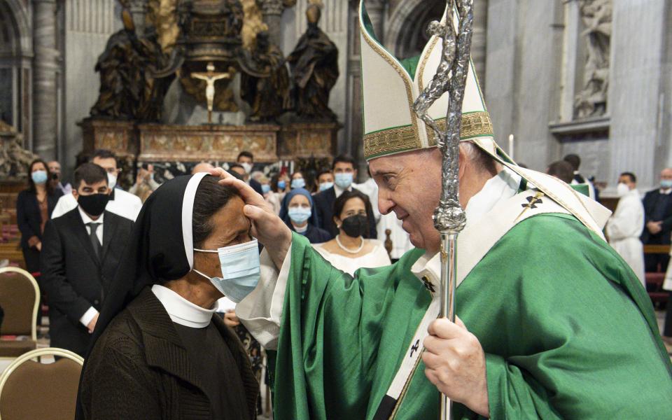 Pope Francis blesses Sister Gloria Cecilia Narváez Argot, a member of the Franciscan Sisters of Mary Immaculate, at the end of Mass in St. Peter's Basilica at the Vatican Oct. 10, 2021. The sister, a missionary from Colombia, was kidnapped in Mali in 2017