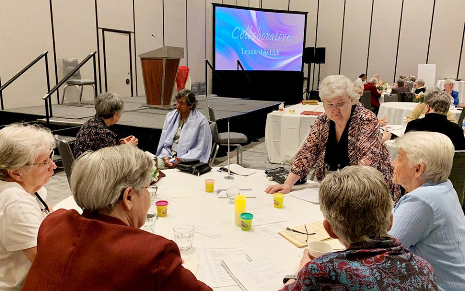 Immaculate Heart of Mary Sr. Anne Munley, standing, associate director of the Leadership Conference of Women Religious' Emerging Life Initiative, facilitates a discussion in Dallas during the summer series of Collaborative Leadership Hubs. (Courtesy of LCWR)