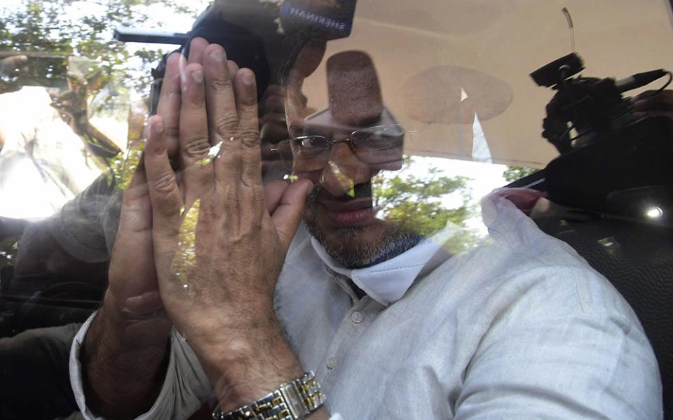 Bishop Franco Mulakkal greets the media as he leaves a court in Kottayam, India, Jan. 14, 2022, after his acquittal of raping a nun. Mulakkal resigned as leader of the Jalandhar Diocese in the northern state of Punjab on June 1, 2023. (AP Photo/File)