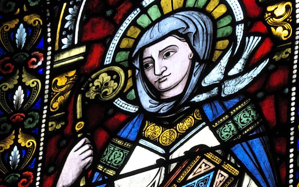 St. Scholastica, depicted in stained glass in the Church of Sainte-Foy in Sélestat, France (Wikimedia Commons/GFreihalter)