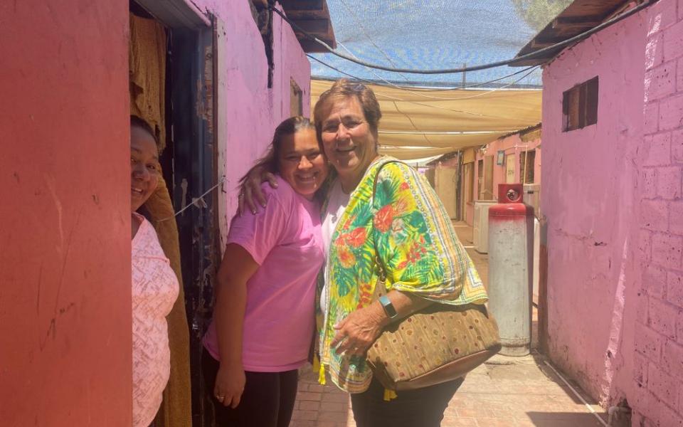 St. Joseph of Carondelet Sr. Suzanne Jabro receives a hug from a woman in Mexicali, Mexico, May 10, 2023, part of a visit through the Border Compassion ministry she founded. The organization is part of a coalition of women religious formed to help migrants on both sides of the border. (GSR photo/Rhina Guidos)
