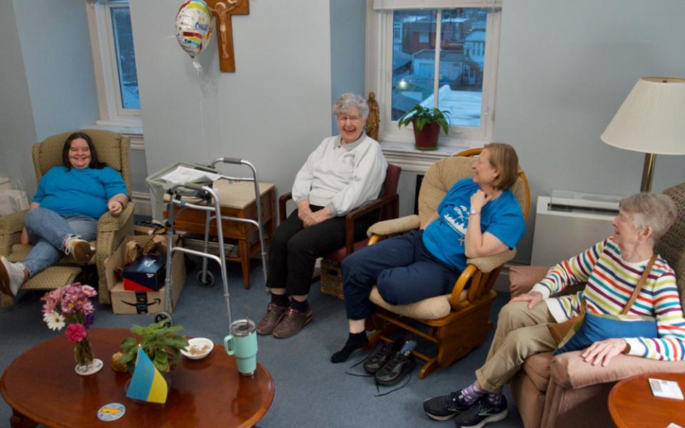 From left, Srs. Sandy Schmid, Emily Meehan, Kristina DeNeve and Pat Quinn relax in their small community's shared space in the motherhouse of the Sisters of St. Joseph of Carondelet in St. Louis. Not shown is Sr. Jo Ann Simanella. Schmid, DeNeve and Quinn are St. Joseph sisters; Meehan and Simanelle are members of the Congregation of Divine Providence. (GSR/Dan Stockman)