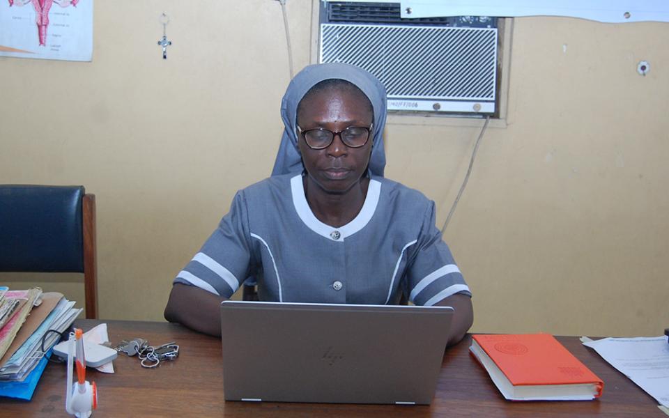 Medical Missionaries of Mary Sr. Maria Obotama, who manages the Family Life Center, in her office. The sisters provide free obstetric fistula surgeries, family planning and maternal health services to women in Mbribit Itam, Nigeria. (Valentine Benjamin)
