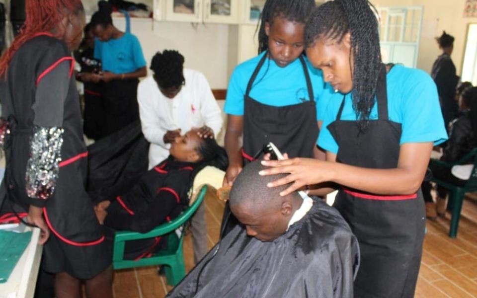 Hairdressing and beauty therapy students participate in a lesson at the Euphrasia Vocational Training Institute, a project of the Sisters of Our Lady of the Good Shepherd in Ngong, Kenya.  (Courtesy of Justicia Nekesa)