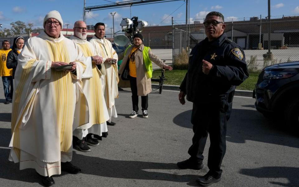 Law enforcement officers prevent clergy from entering the Broadview ICE facility and offering Communion to immigrants detained inside, during an outdoor Mass in the Broadview section of Chicago Nov. 1. (OSV News/Leah Millis, Reuters)