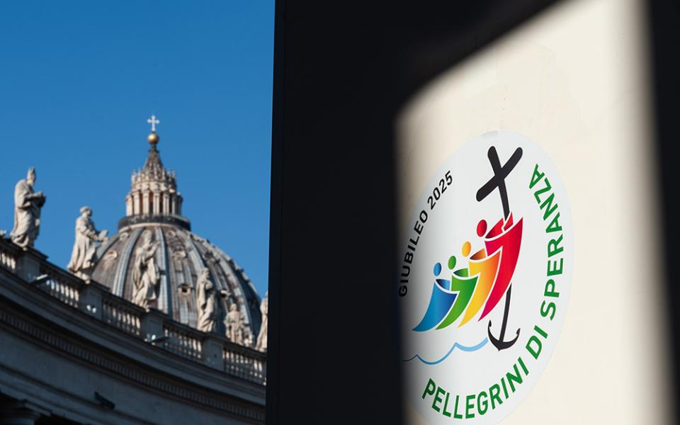 A combination photo shows St. Peter’s Basilica and the logo chosen by the Vatican for the Holy Year 2025. Following Pope Francis' invitation to "be tangible signs of hope" for those experiencing hardships, Sr. Mary Nguyen made a pilgrimage to visit a friend. (OSV News/Catholic Press Photo/Massimiliano Migliorato)