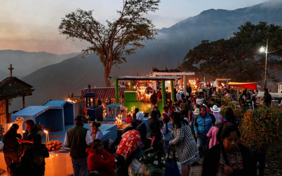 People gather at a cemetery to visit the graves of their loved ones during the Day of the Dead festivities, in Mazatlan Villa de Flores, Mexico, Nov. 2, 2025. The traditional celebration honors children on All Saints' Day, Nov. 1, and adults on All Souls' Day, Nov. 2. (OSV News/Reuters/Jorge Luis Plata)