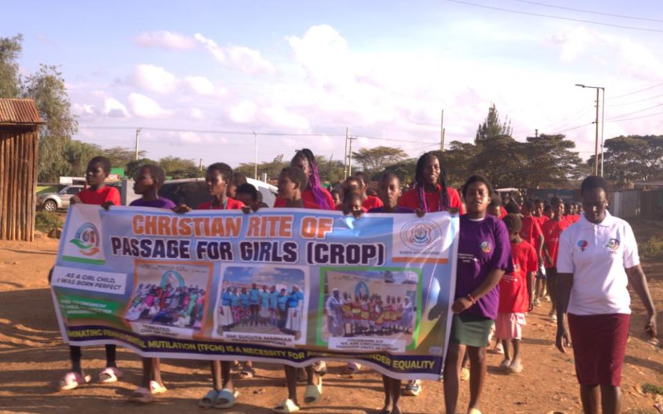 Girls rescued from female genital cutting march through the streets of Suguta Marmar in northern Kenya to educate the community about the harms of the practice.