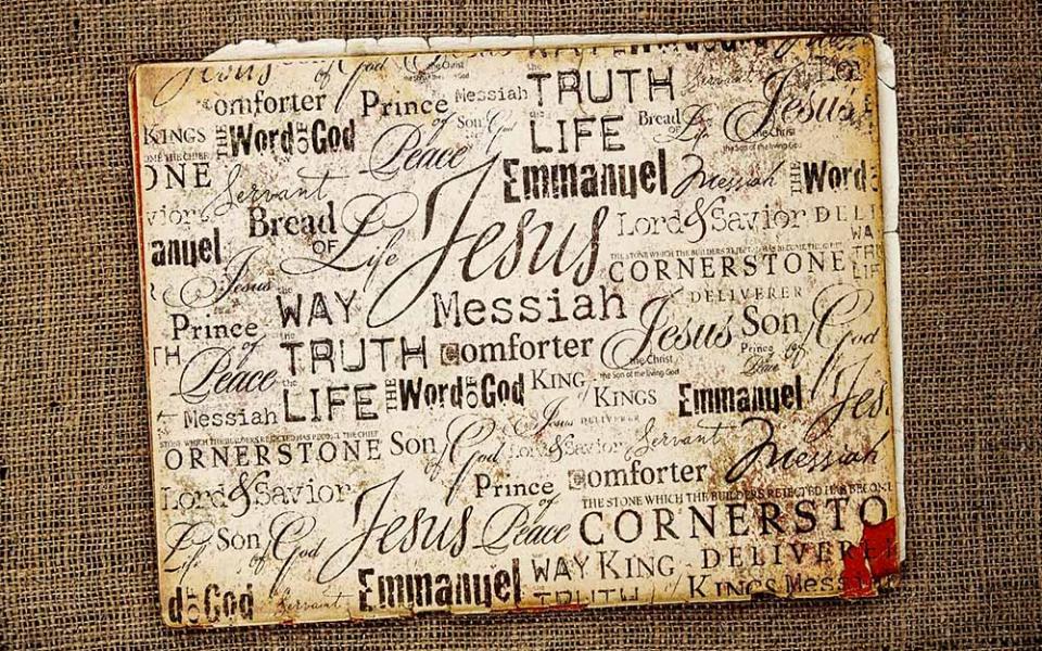 A collection of words for Jesus in different fonts, on a burlap background (Dreamstime/Genotar)