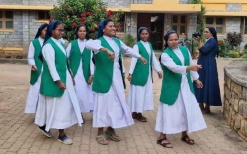 Sr. Soniya K. Chacko, a member of the Daughters of Charity of St. Vincent De Paul, appears with community members during a photo shoot in Vellanchira, Chalakudy, Kerala, southwestern India. The Rotary Club of Thiruvananthapuram selected her for its Digital Missionary Award of 2025, citing her courage, clarity and conviction in using social media to witness her faith. (George Kommattam)