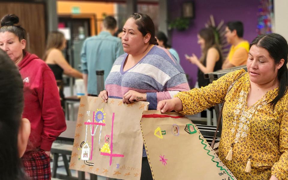 Migrant mothers share some of their art expressions during Mother's Day activities in the Kino Border Initiative comedor in Nogales, Mexico. (Courtesy of Eileen McKenzie)
