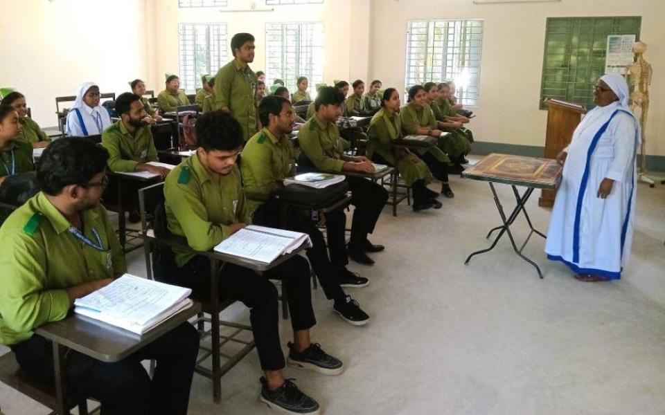 Sr. Mary Dipa, principal of St. Mary's Catholic Nursing Institute in Toomilia, Bangladesh, teaches students. The Sisters of Mary Queen of the Apostles founded the program three years ago. (Sumon Corraya)