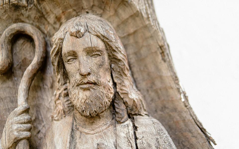 Jesus the Good Shepherd, carved in wood (Unsplash/Karl Raynund Catabas)