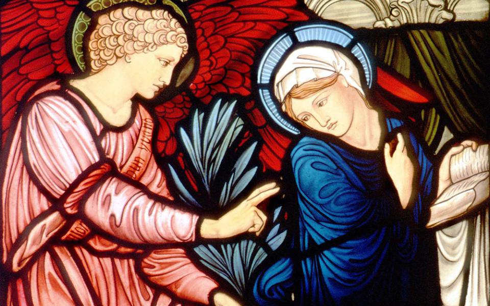 The angel Gabriel greets Mary in this church window depicting the Annunciation. (CNS photo from Crosiers)