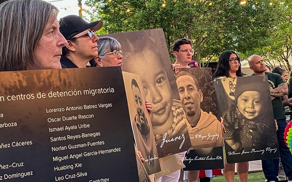 Demonstrators hold placards with photographs and names of people who died in immigration-related circumstances as they take part in a protest in El Paso, Texas, March 24, 2026, against mass deportations and the immigration policies of the Trump administration. (NCR photo/Pauline Hovey).