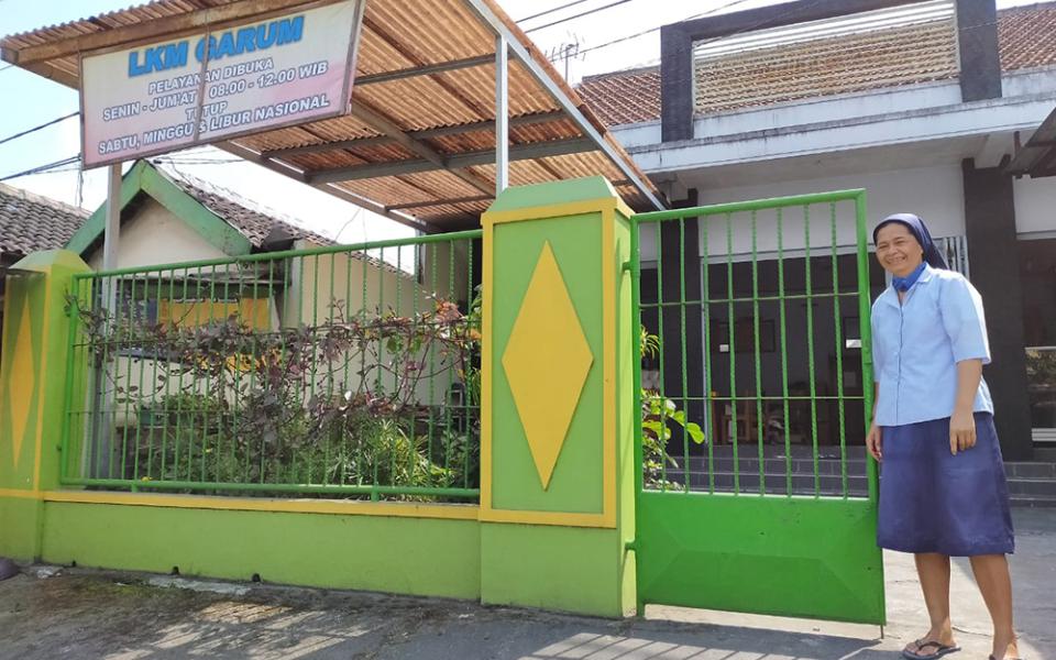 Sr. Gracia L. Suparti of the Daughters of Charity gets ready for a home visit. In 2019, Suparti founded the Migrant Family Association in Garum, a small sub-district near Blitar's capital, to help migrant families with their expenses and navigate poverty-related issues. (Courtesy of the Daughters of Charity)