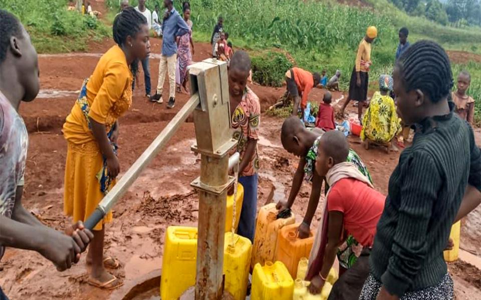 When improving access to water, local leadership is essential. Communities in Walungu Territory in South Kivu Province, Democratic Republic of Congo, form water committees to manage and maintain sources. Women play central roles — because they understand water needs best. (Courtesy of Namulisa Balaluka Rose)