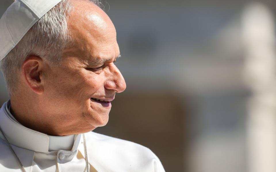 Pope Leo XIV smiles as he greets visitors and pilgrims from the popemobile while riding around St. Peter’s Square at the Vatican before his weekly general audience May 20, 2026. (CNS photo/Lola Gomez)