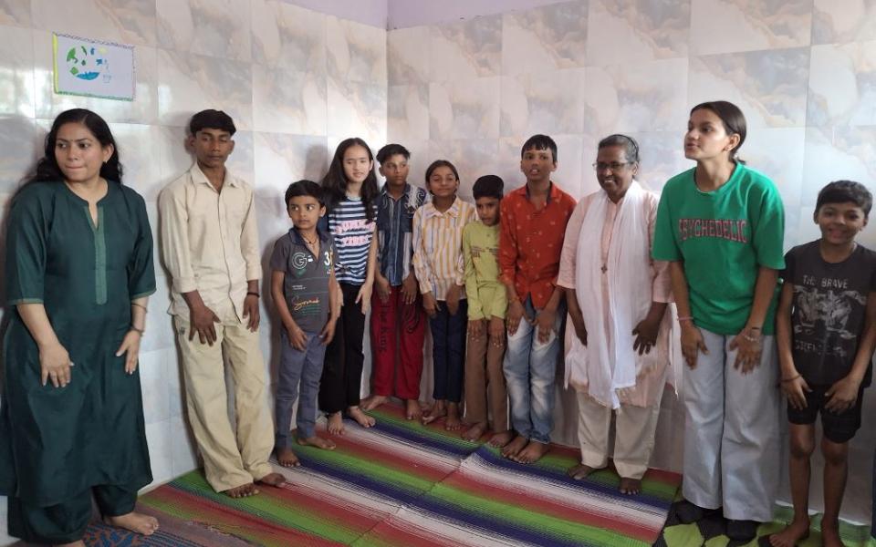 Sr. Connie Callista, a member of the Holy Cross Sisters of Chavanod, works with children doing indoor training at Trilokpuri, an enclave in East Delhi, India. (Lissy Maruthanakuzhy)