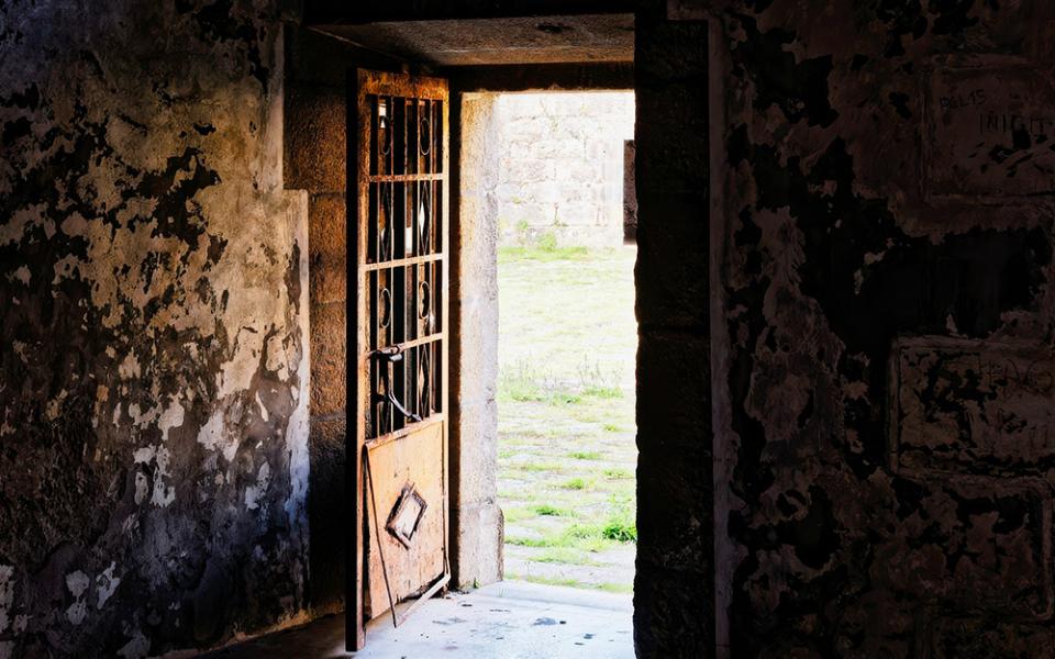 Door in a dilapidated building open to the outside (Unsplash/Eric Prouzet)