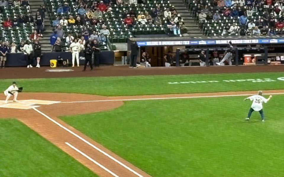 Sr. Debra Sciano throws out the ceremonial first pitch at a Milwaukee Brewers game June 17. Sciano, who will become president of the Leadership Conference of Women Religious Aug. 1, is such a big baseball fan she keeps score during games on a paper scorecard. (Courtesy of Kathy Sciano Lamb)