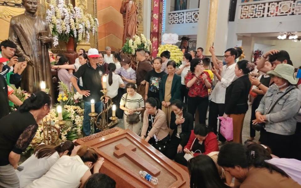 Pilgrims pray by the tomb of Blessed Francis Xavier Truong Buu Diep at Tac Say Pilgrimage Center in Vietnam's Mekong Delta on July 1, 2026. (OSV News/Joachim Pham)