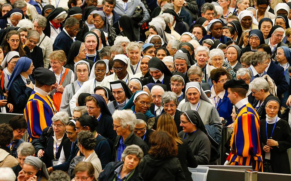 The heads of women's religious orders leave an audience with Pope Francis in Paul VI hall at the Vatican May 12, 2016. During the session with members of the International Union of Superiors General, sisters asked Francis about the possibility of women deacons returning to the church. (CNS/Paul Haring)