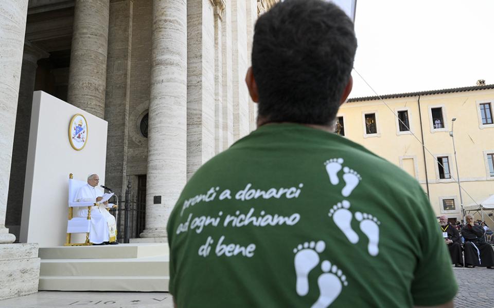 A young man listens to Pope Leo XIV during a meeting between the pope and young people taking part of the "Go! Franciscan Youth Meeting 2026" in Piazza Santa Maria degli Angeli in Assisi, Italy, Aug. 6, 2026. (OSV News/Vatican Media/Simone Risoluti)