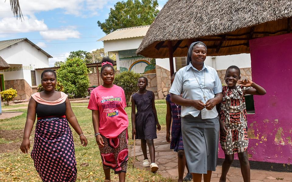 Sr. Sharon Shabolyo of the Sisters of Charity of Sts. Bartolomea Capitanio and Vincenza Gerosa with some of the girls she helps care for at the Mudzi-Wa-Moyo Orphanage in the Chirundu District of Zambia. (Derrick Silimina)