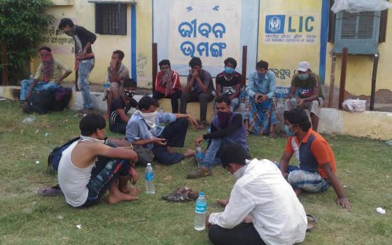 Migrants from Maharashtra traveled by truck and were left May 25 at Bondamunda, Odisha, in India. They sat in the sun without food for an entire day. The author and her congregation, the Missionary Sisters Servants of the Holy Spirit, gave them food and m